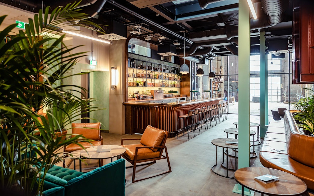 Roe & Co Distillery bar area with seating and modern decor.