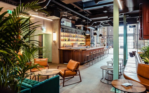 Roe & Co Distillery bar area with seating and modern decor.