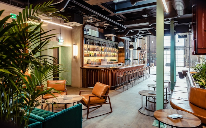 Roe & Co Distillery bar area with seating and modern decor.