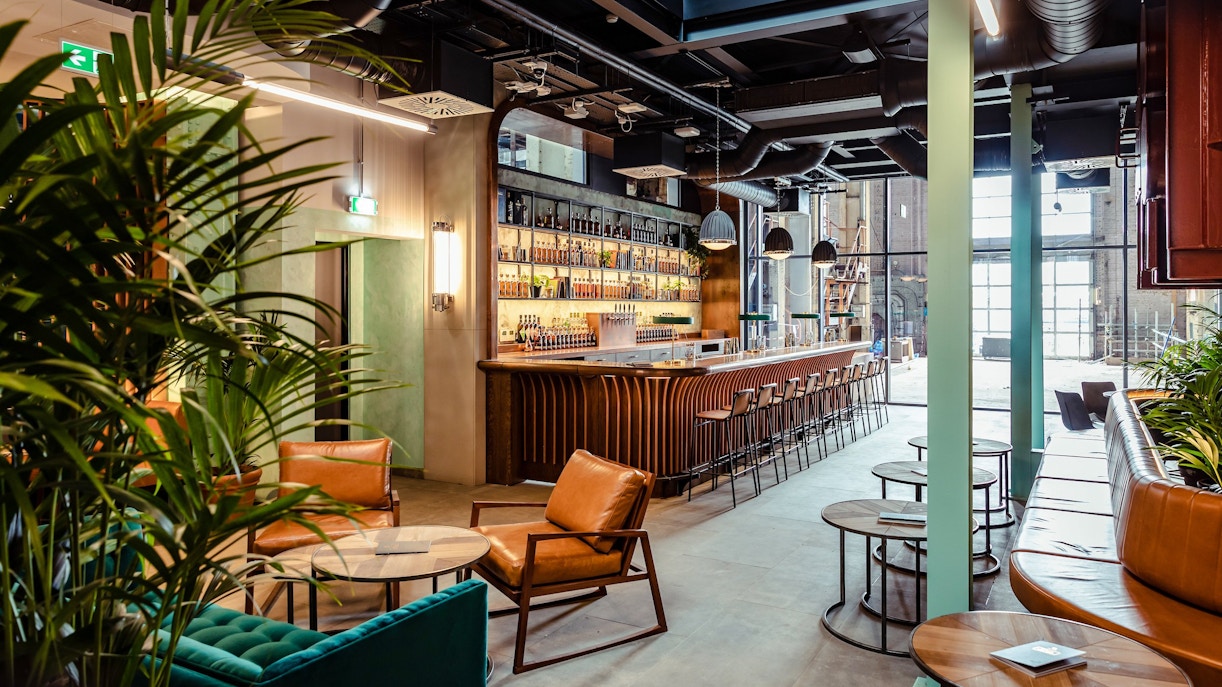 Roe & Co Distillery bar area with seating and modern decor.