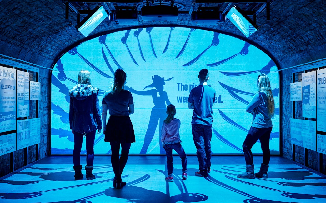 Visitors exploring an interactive exhibit at a Dublin attraction.