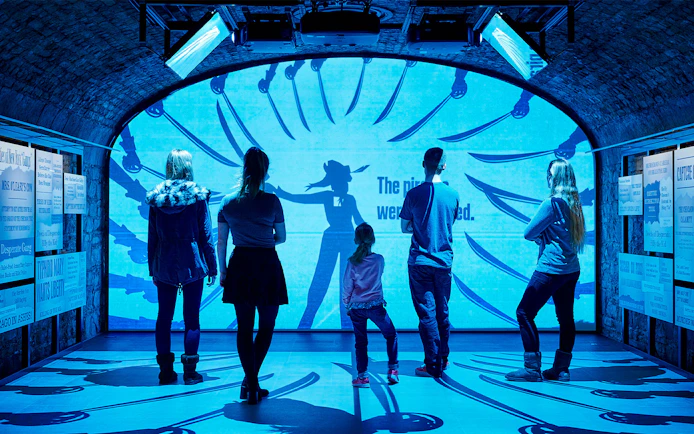 Visitors exploring an interactive exhibit at a Dublin attraction.