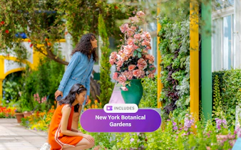 Guests admiring colorful flowers at New York Botanical Garden.