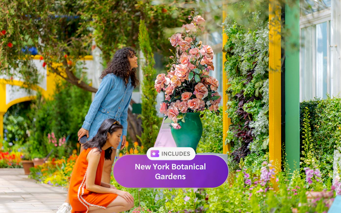 Guests admiring colorful flowers at New York Botanical Garden.
