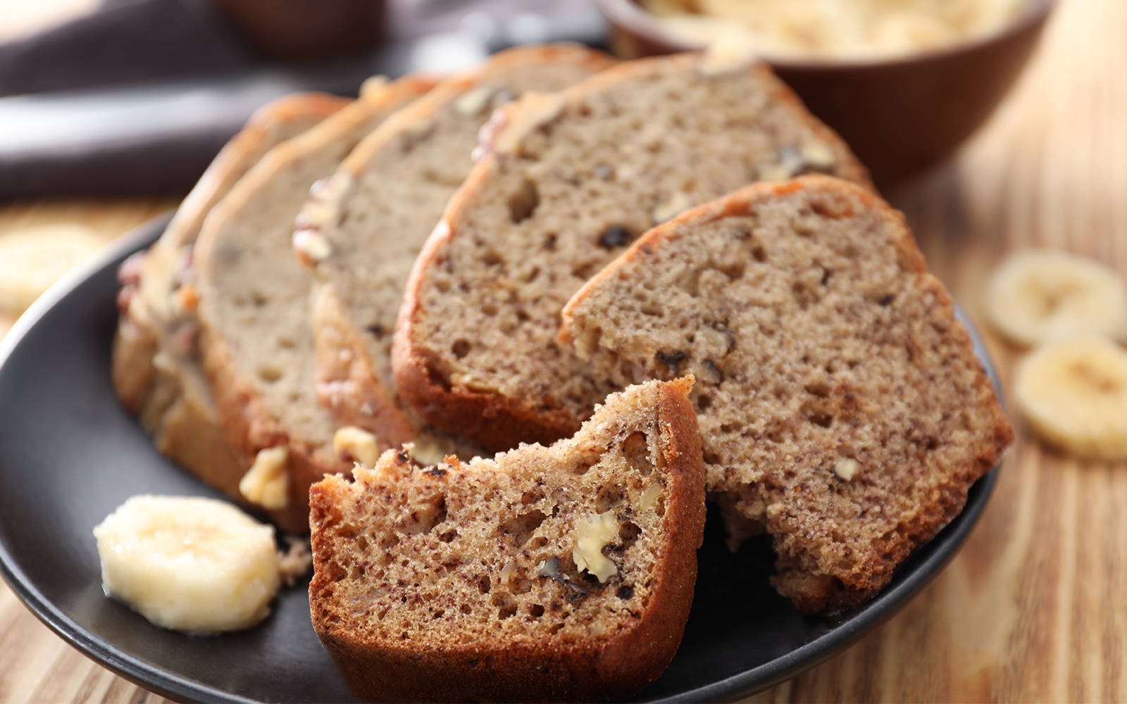 Sliced banana bread with nuts on plate