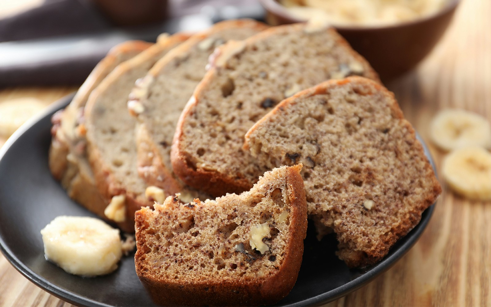 Sliced banana bread with nuts on plate