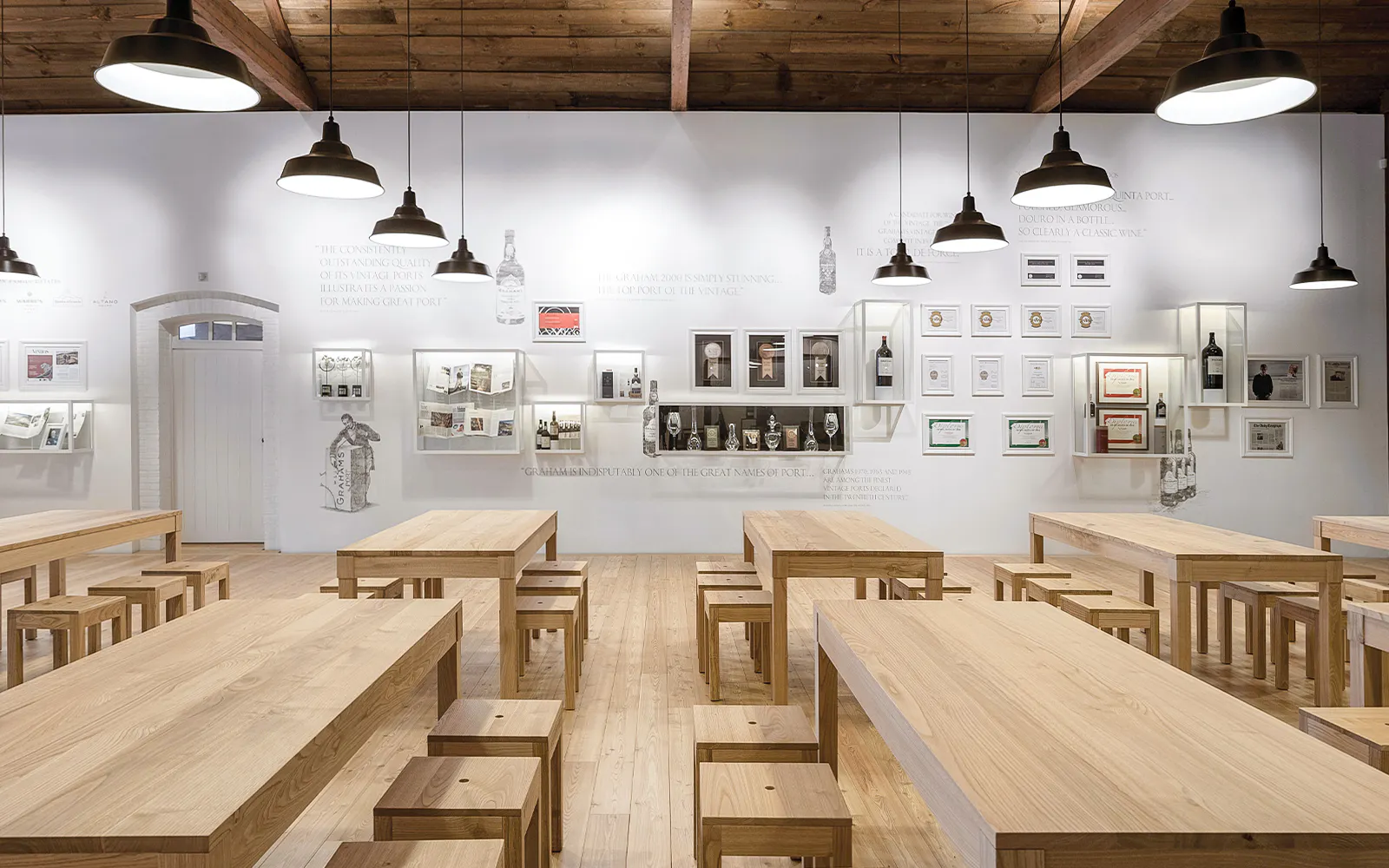 Graham's Port Lodge tasting room with wooden tables and wine displays.