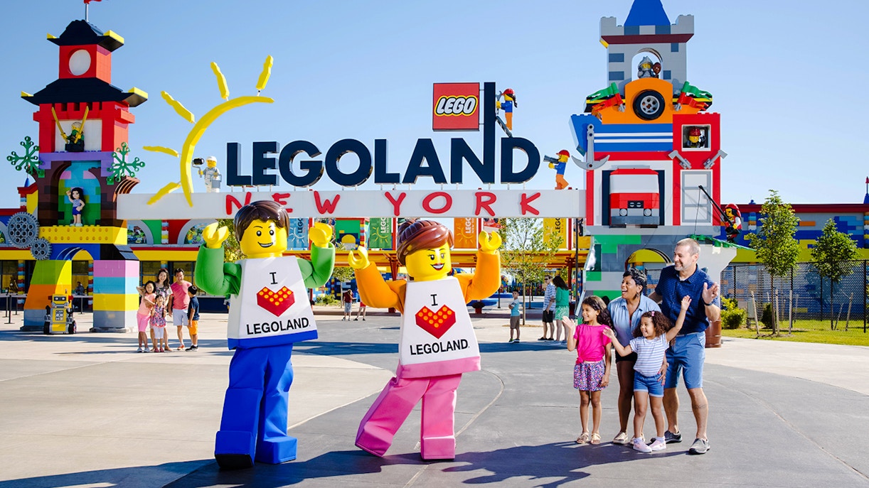 Guests enjoying the entrance of Legoland New York with colorful Lego structures.