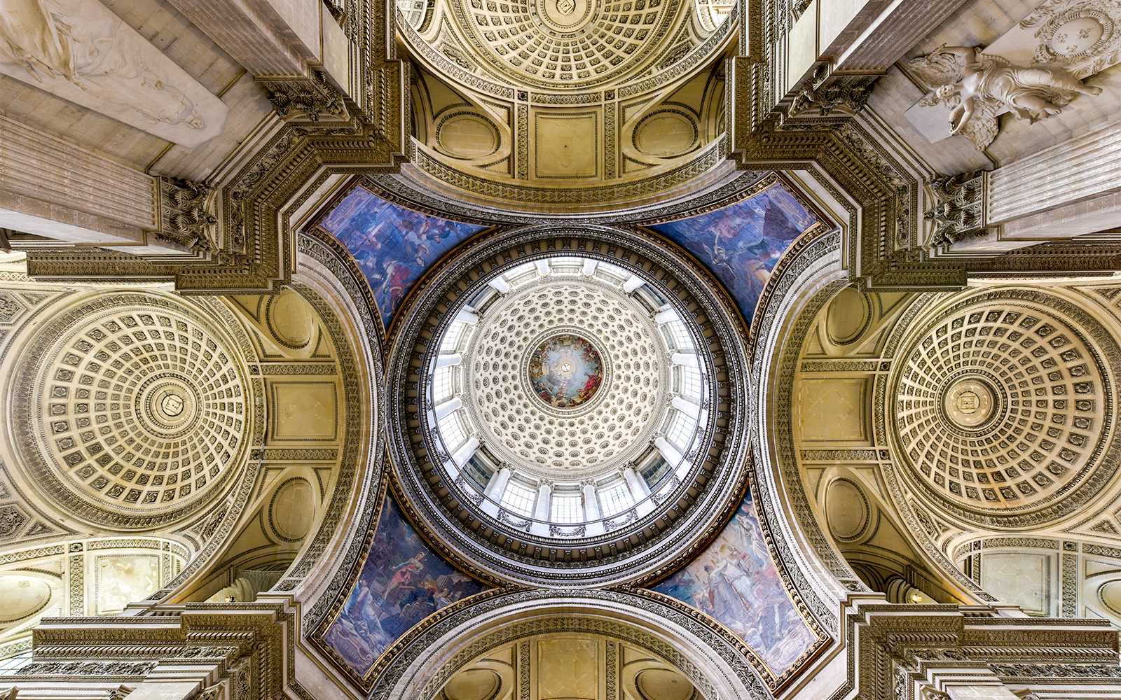 high ceilings and walls are adorned with beautiful artwork at Paris Pantheon