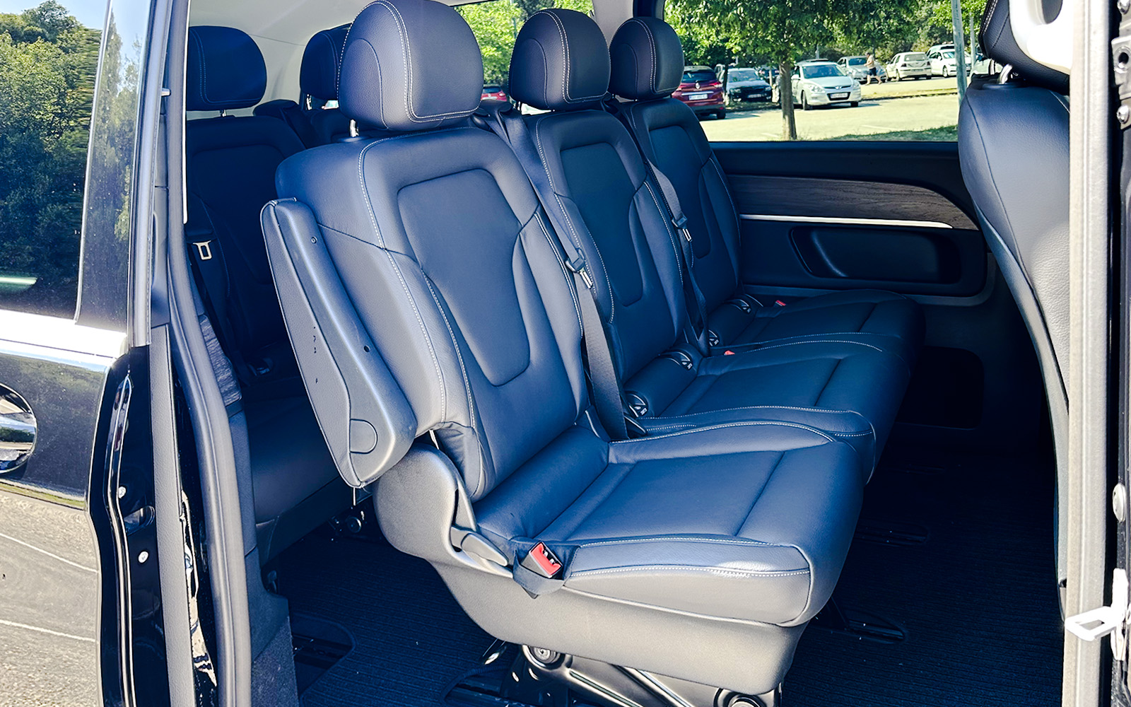 Mercedes E Class interior with black leather seats and spacious rear seating.