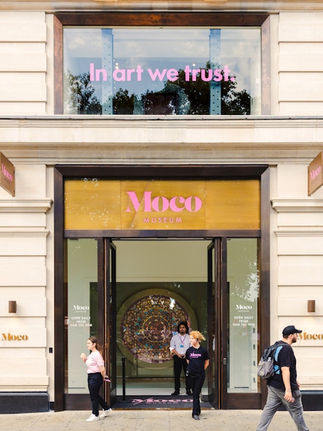 Moco Museum London exterior with visitors and art displays.