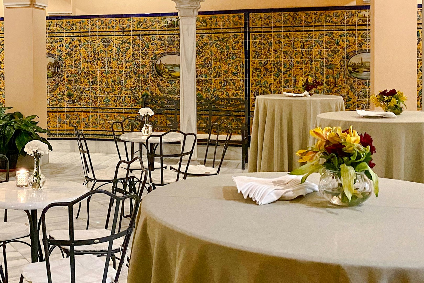 Dining tables with floral centerpieces at Triana Theater.