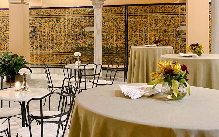 Dining tables with floral centerpieces at Triana Theater.