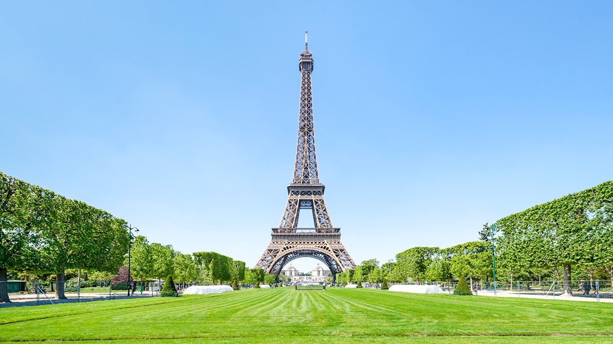 Eiffel Tower with surrounding gardens during day trips in France.