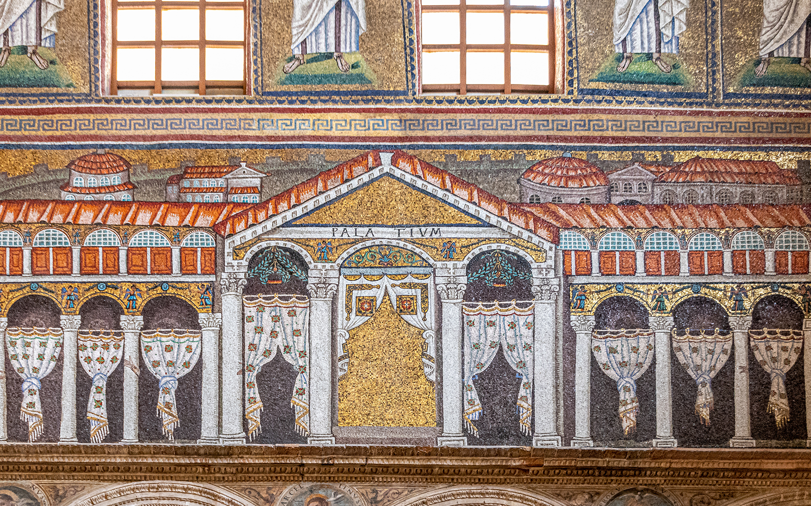 Ravenna mosaic depicting ancient architecture with detailed columns and arches.