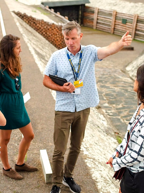 Guests with a tour guide at Sachsenhausen Concentration Camp Memorial, Germany.