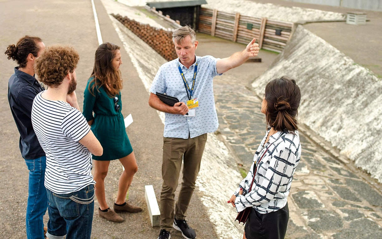Guests with a tour guide at Sachsenhausen Concentration Camp Memorial, Germany.