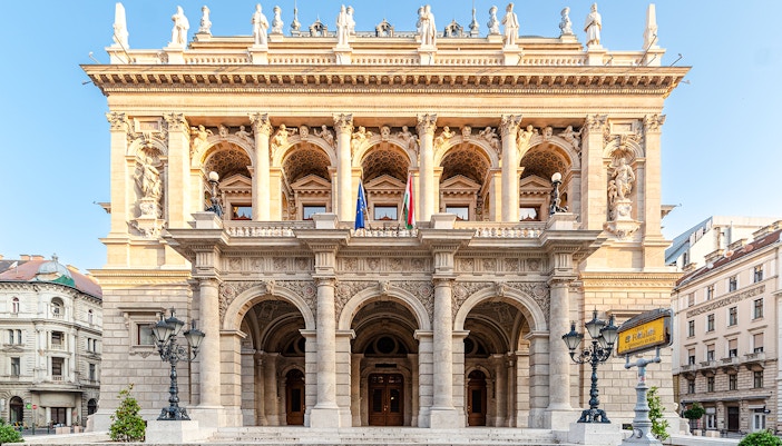 Hungarian State Opera exterior with ornate columns and statues, Budapest.
