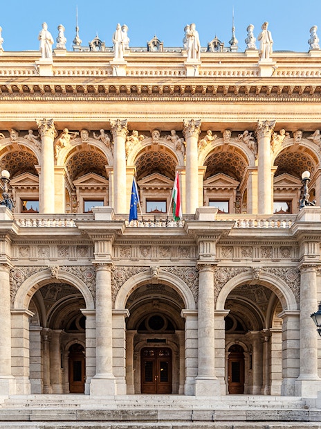Hungarian State Opera exterior with ornate columns and statues, Budapest.