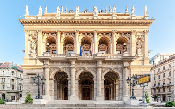 Hungarian State Opera exterior with ornate columns and statues, Budapest.