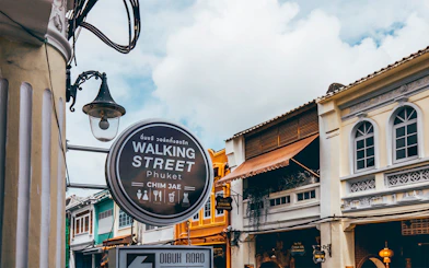 Walking Street sign and colorful buildings in Phuket, Thailand.