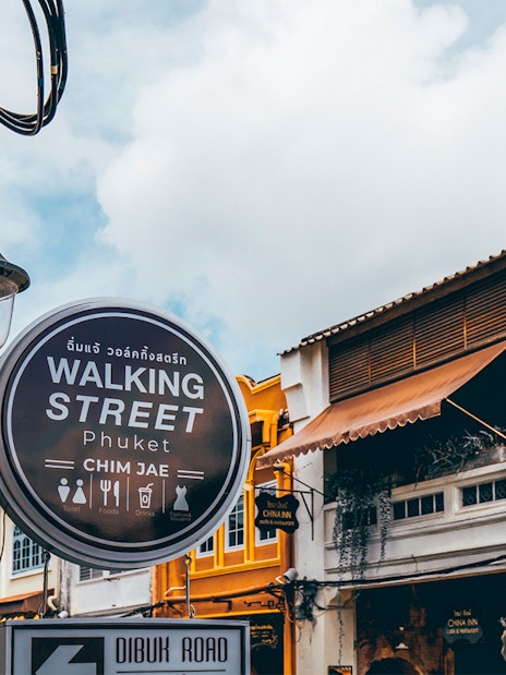 Walking Street sign and colorful buildings in Phuket, Thailand.