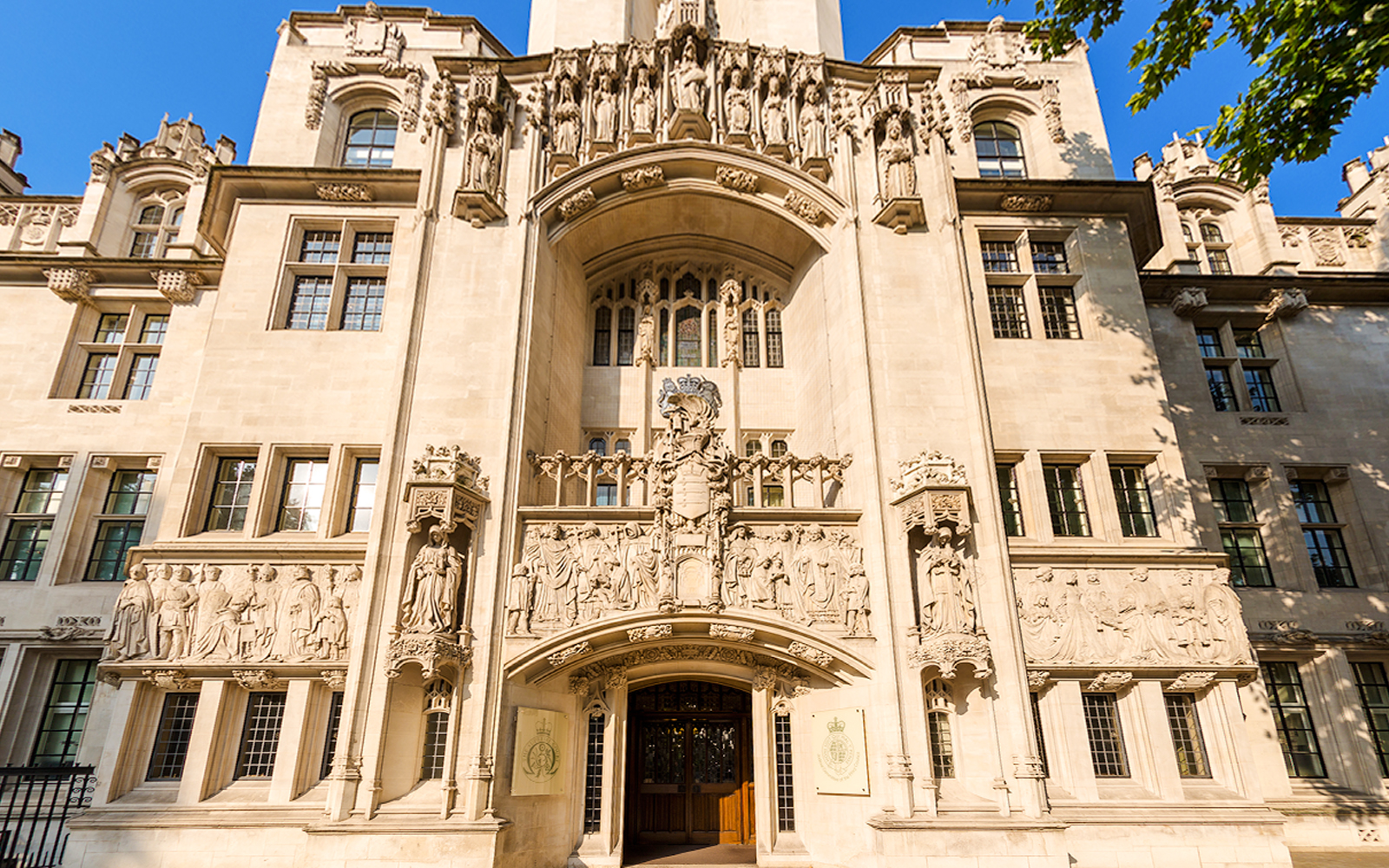 Supreme Court of the United Kingdom facade with detailed sculptures, London, England.