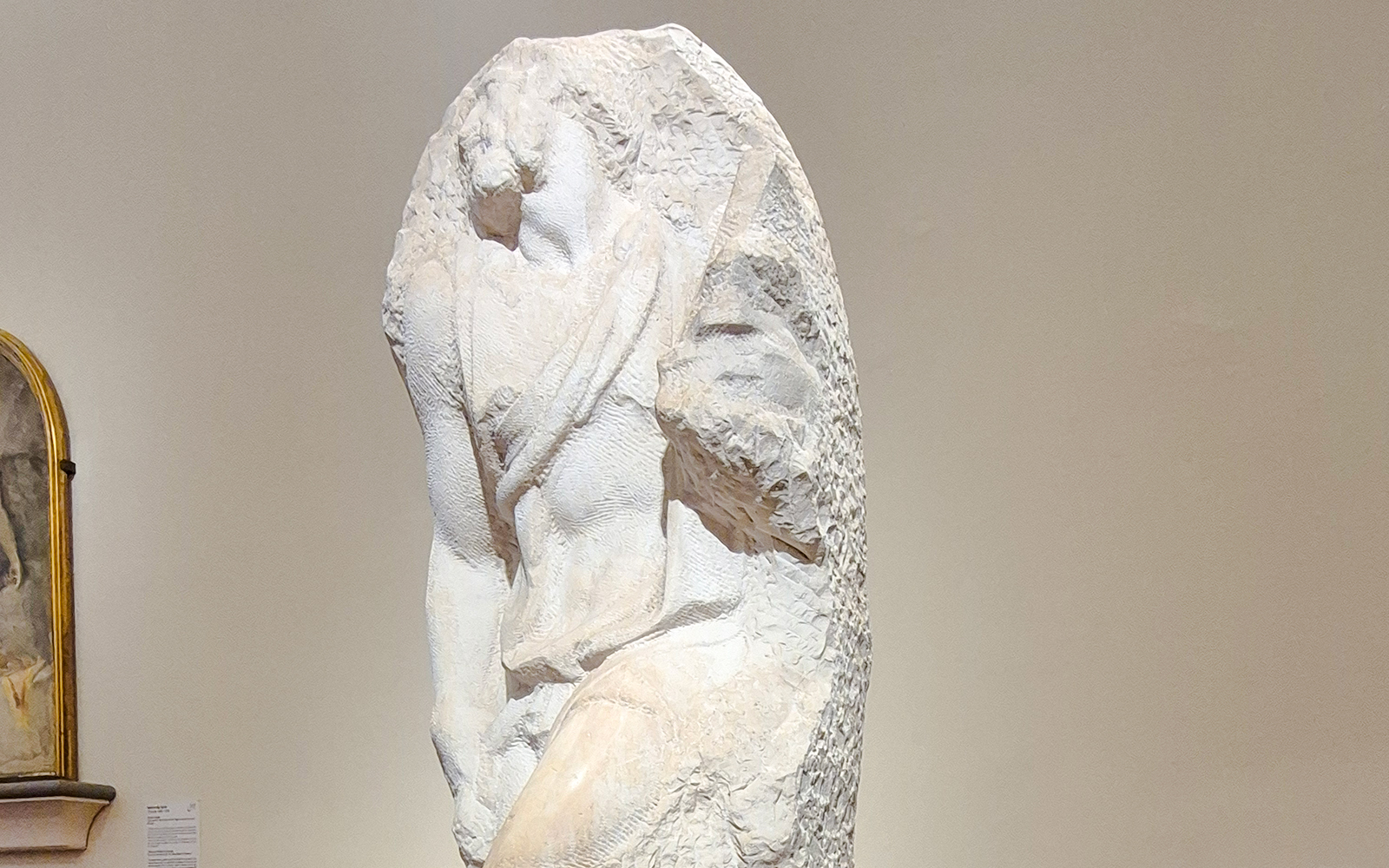 Awakening Slave sculpture by Michelangelo in Accademia Gallery, Florence.