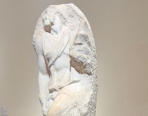 Awakening Slave sculpture by Michelangelo in Accademia Gallery, Florence.