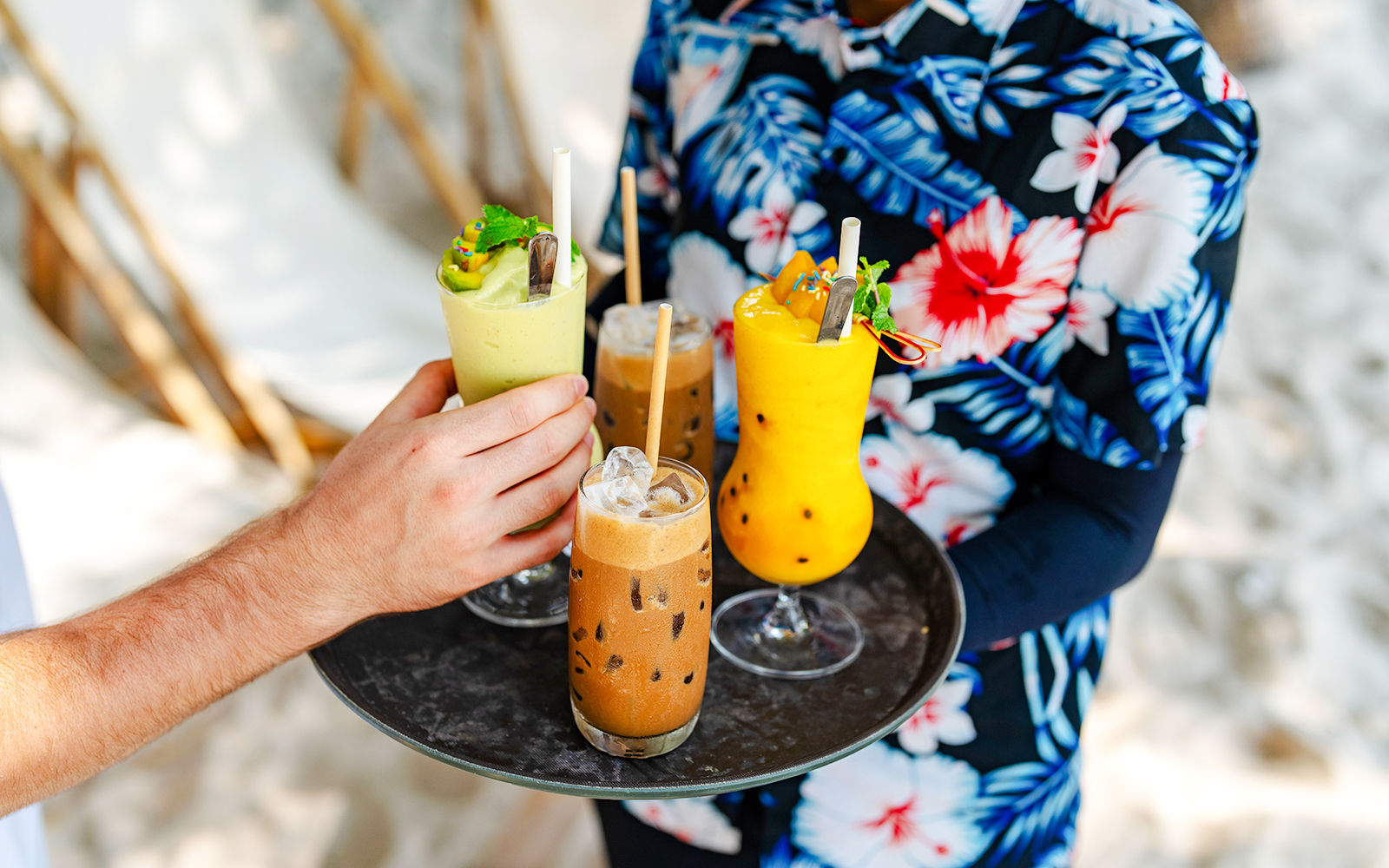 Beachside drinks being served on a tray at Cap d’Ail.
