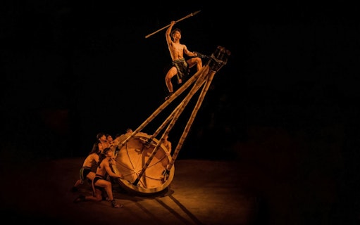 Performers at Teh Dar Vietnamese Bamboo Circus under iconic dome.