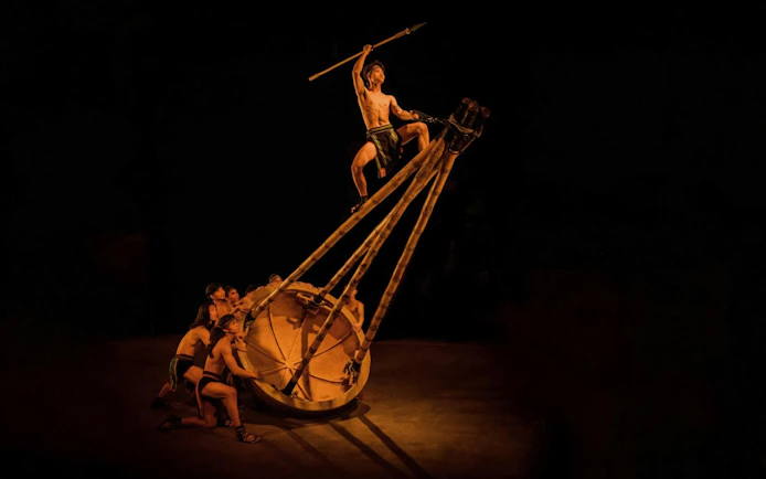 Performers at Teh Dar Vietnamese Bamboo Circus under iconic dome.