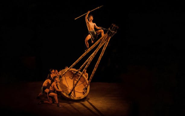 Performers at Teh Dar Vietnamese Bamboo Circus under iconic dome.