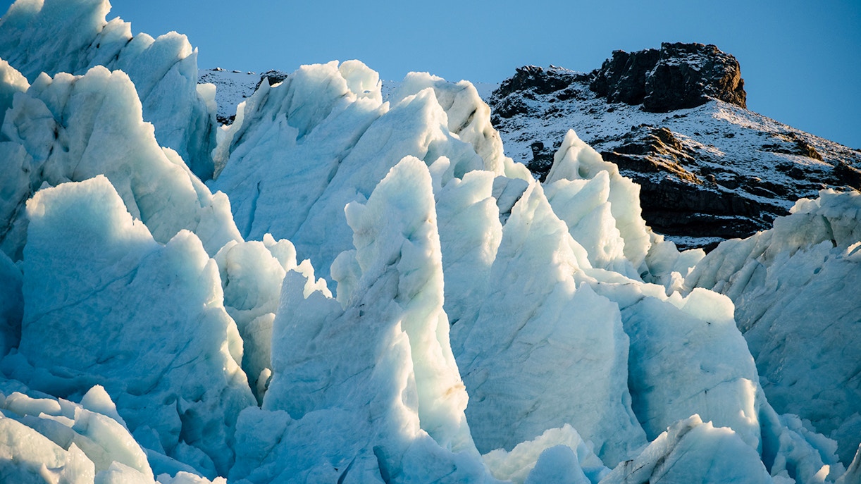 Vatnajökull Ice Cap with jagged ice formations under clear sky.