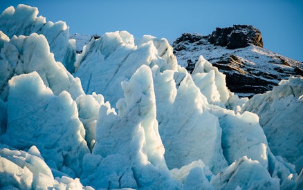 Vatnajökull Ice Cap with jagged ice formations under clear sky.