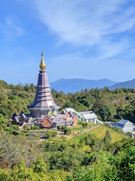 Noppamethanedon and Nopphonphusiri pagodas on Kew Mae Pan trail, Doi Inthanon, surrounded by lush greenery.