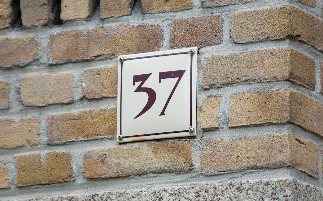 House number 37 on brick wall, Amsterdam.