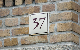 House number 37 on brick wall, Amsterdam.