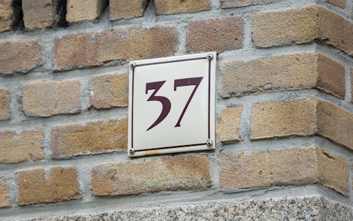 House number 37 on brick wall, Amsterdam.