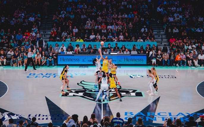 Players at center court during a basketball game at Barclays Center, New York Liberty.