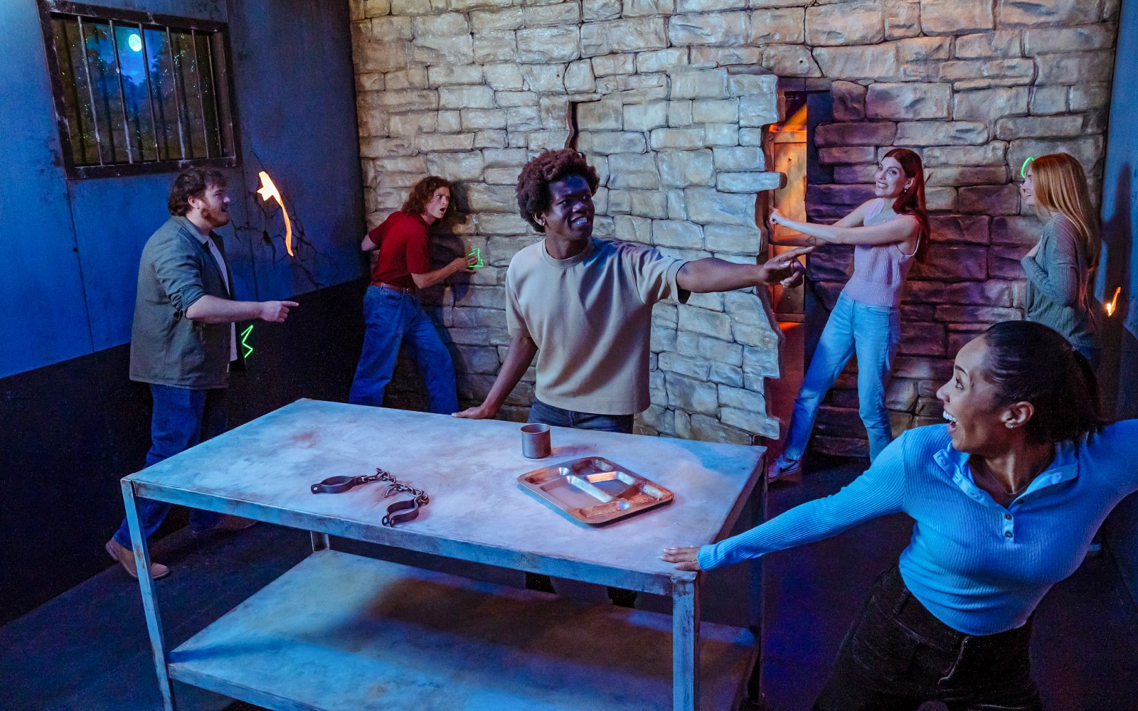 Group solving escape room challenge at Netflix House, OnePiece Play, Philadelphia.