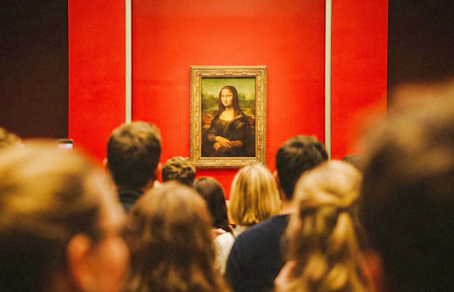 Tourists viewing the Mona Lisa at the Louvre Museum, Paris, France.