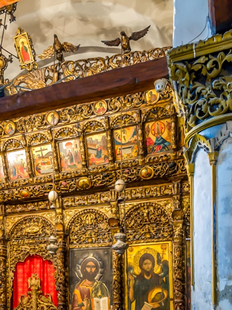 Ornate wooden iconostasis with religious paintings inside Berat Castle, Albania.