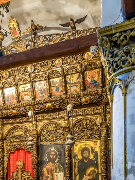 Ornate wooden iconostasis with religious paintings inside Berat Castle, Albania.