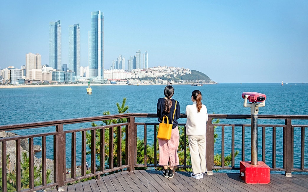 Viewing platform overlooking Haeundae Beach and skyscrapers in Busan, South Korea.