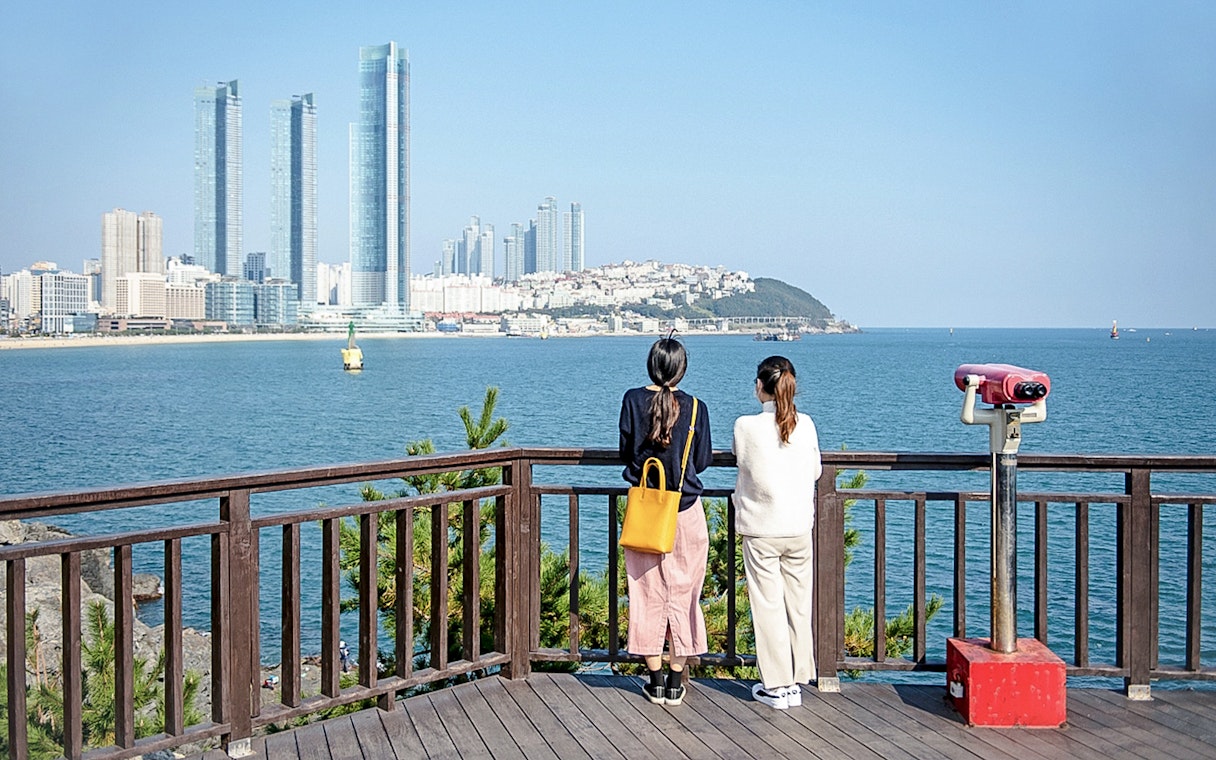 Viewing platform overlooking Haeundae Beach and skyscrapers in Busan, South Korea.