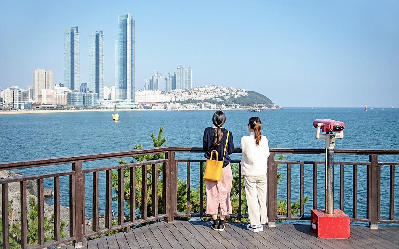Viewing platform overlooking Haeundae Beach and skyscrapers in Busan, South Korea.