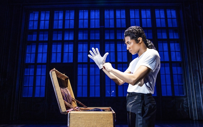 Performer wearing a sequined glove at MJ Live Tribute Concert.