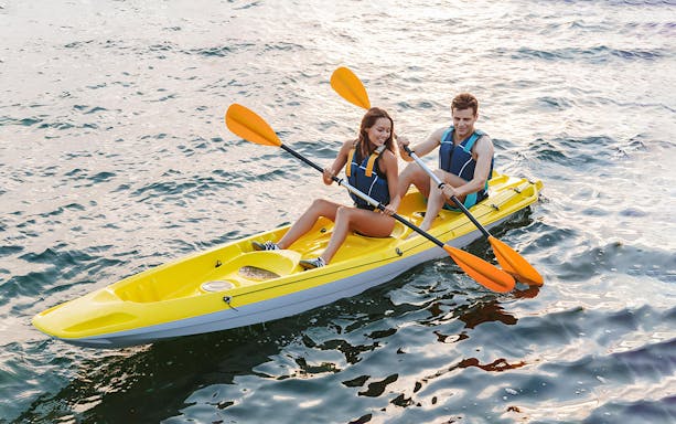 Two people kayaking on Ieranto Bay during a 4-hour tour.