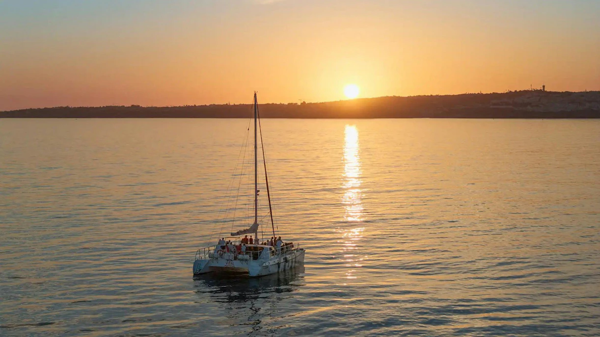 Catamaran sailing at sunset on Algarve tour from Vilamoura.